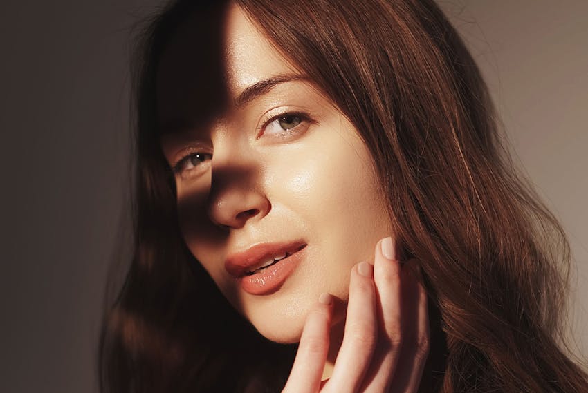Woman touching her face