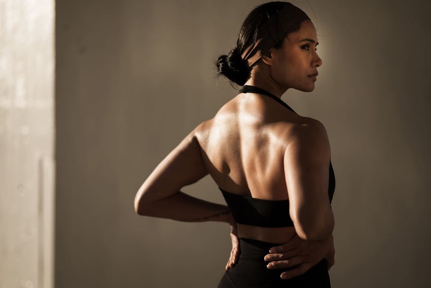 women flexing her back