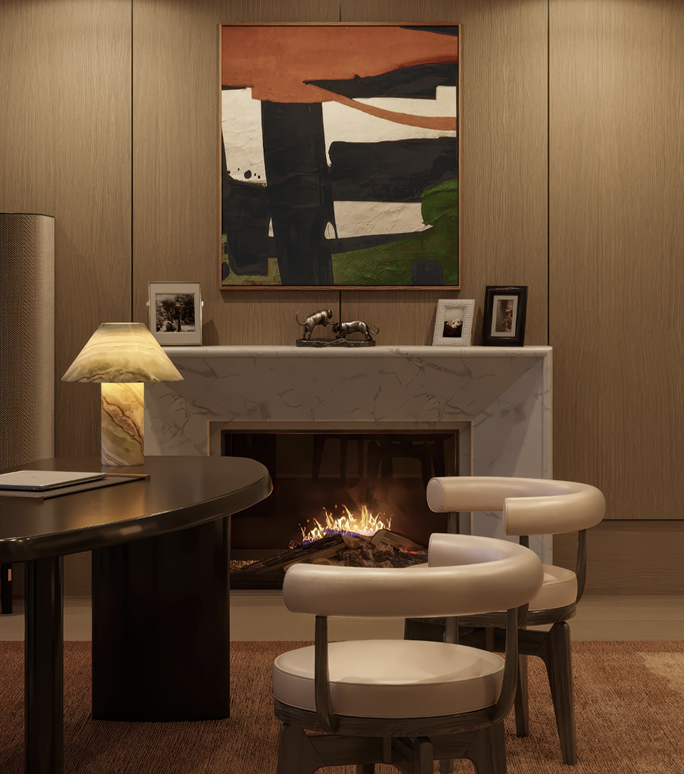 Richards Stanisich study with a marble fireplace, abstract painting, dark desk, onyx lamp and cream chairs