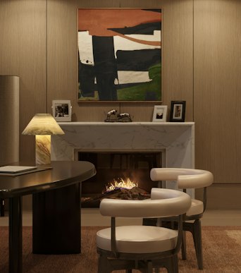 Richards Stanisich study with a marble fireplace, abstract painting, dark desk, onyx lamp and cream chairs