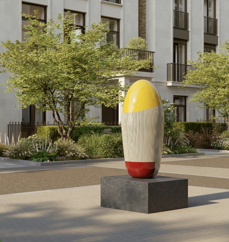 Yellow, striped and red egg-shaped sculpture on a stone plinth in front of the residences