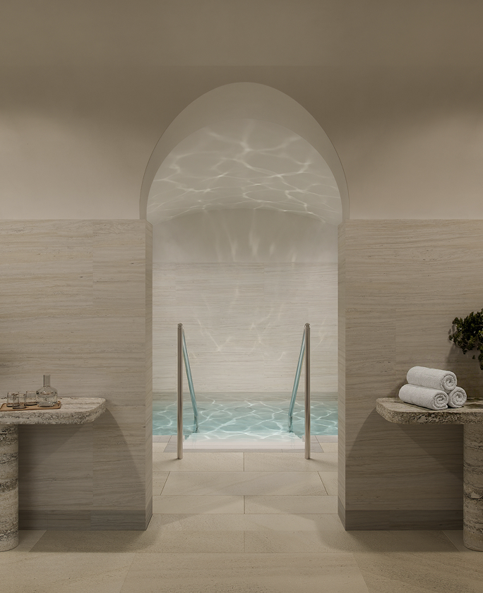 Stone-lined arch to a plunge pool at The Riding Club for residents of St John's Wood Square luxury residences.