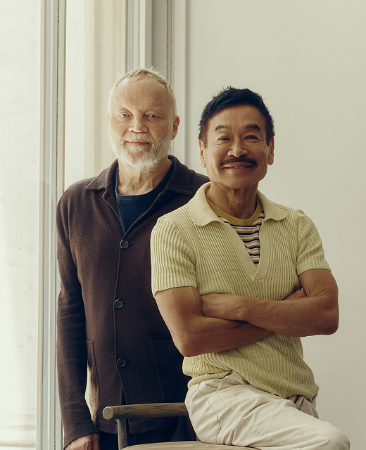 The two founders of Yabu Pushelberg by a sunlit window, one seated with his arms folded