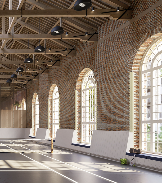Indoor tennis court with timber roof trusses and arched windows at The Riding School, for St. John's Wood Square residents.