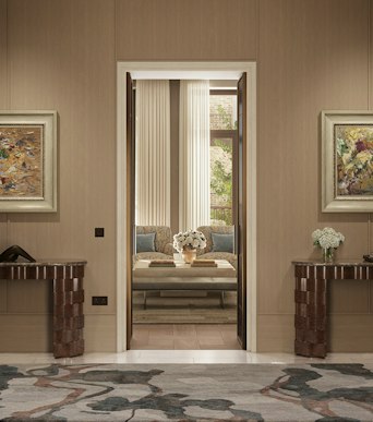 Hallway of a designer apartment in London, an open door revealing two chairs, a coffee table and curtained windows beyond