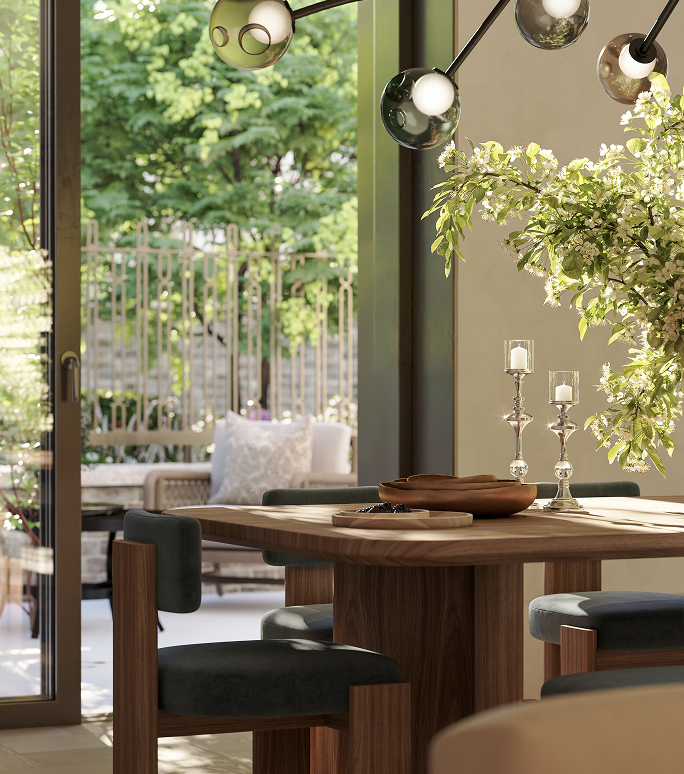 Dining table set with candlesticks before glazed doors looking out onto a planted garden, in luxury apartments in London for sale.
