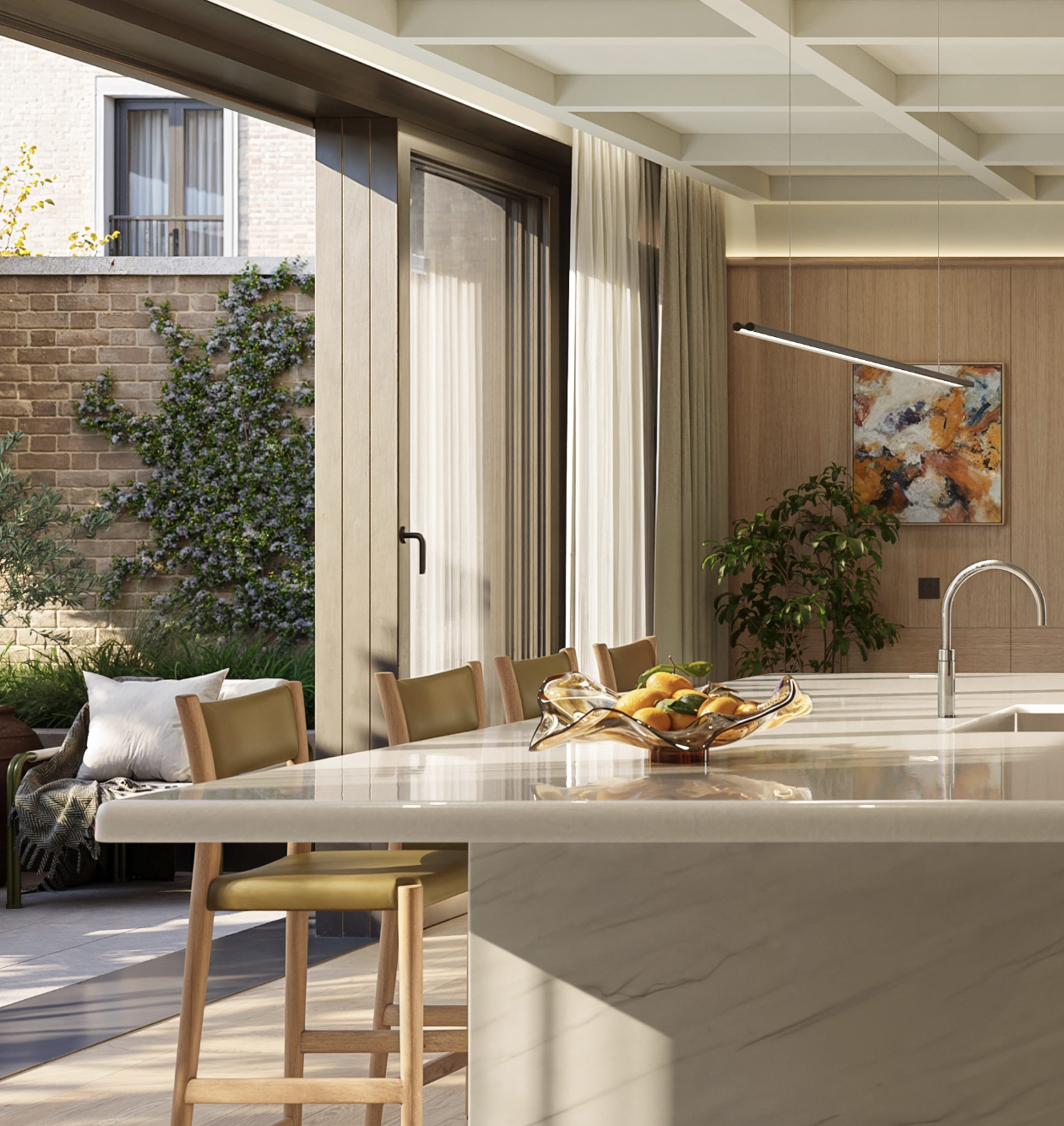 Kitchen island with four chairs in a luxury townhouse in London, with full-height glazed doors opening onto a planted garden