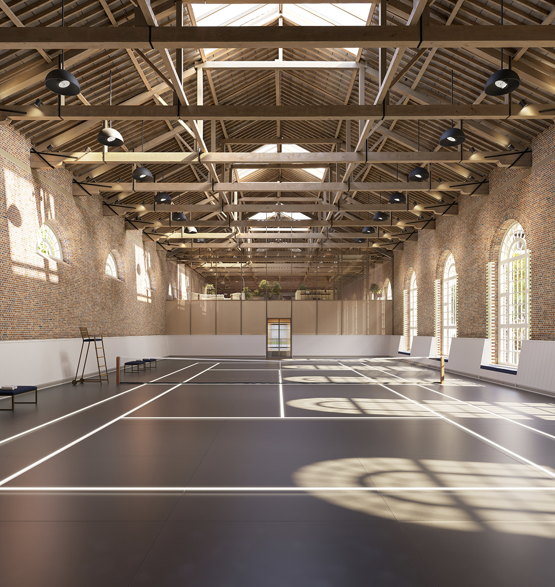 Indoor tennis court with timber roof trusses and arched windows at The Riding School, for St. John's Wood Square residents.