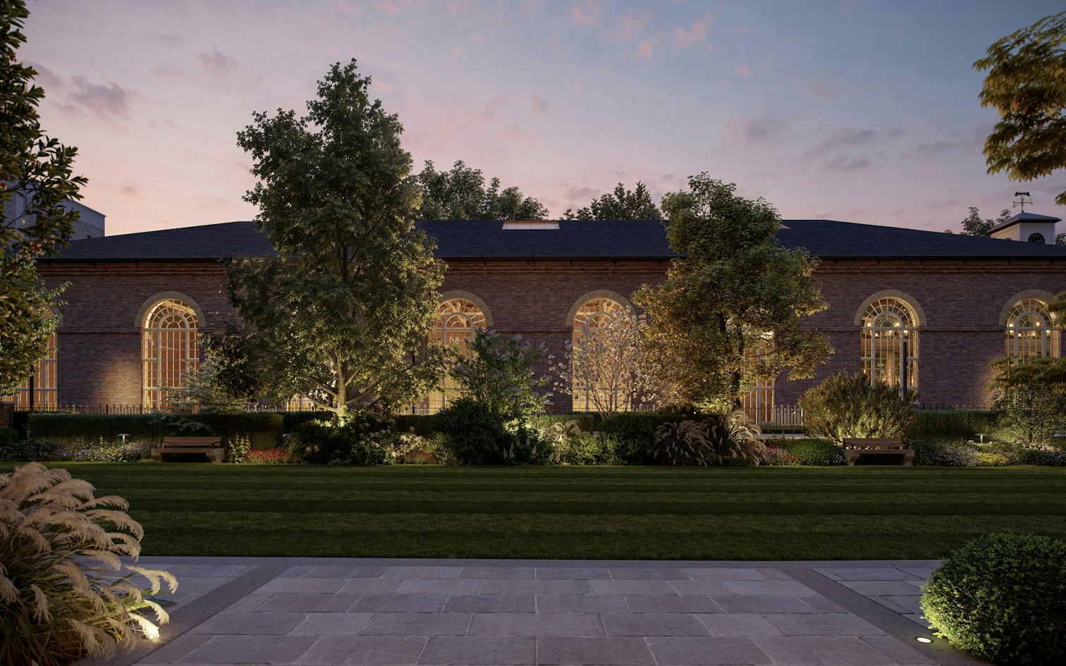 The 1825 Riding School, reimagined as The Riding Club, seen across The Lawn at St John's Wood Square in London