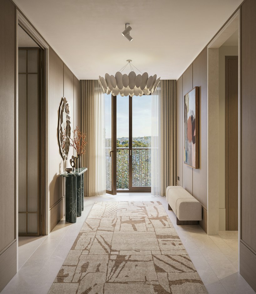 Hallway of St John's Wood Square's luxury apartments in London, with a sculptural pendant light, marble console, and full-height balcony doors.