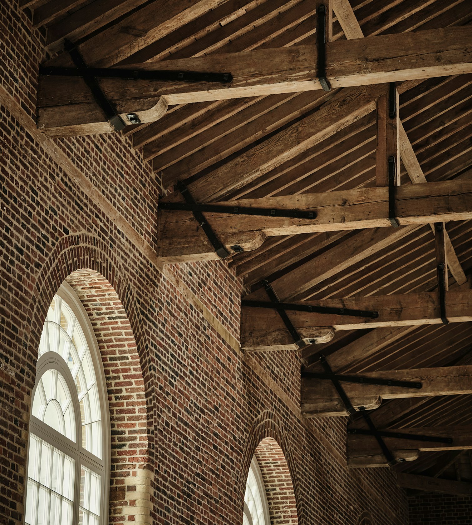 restored wooden beams in The Riding School
