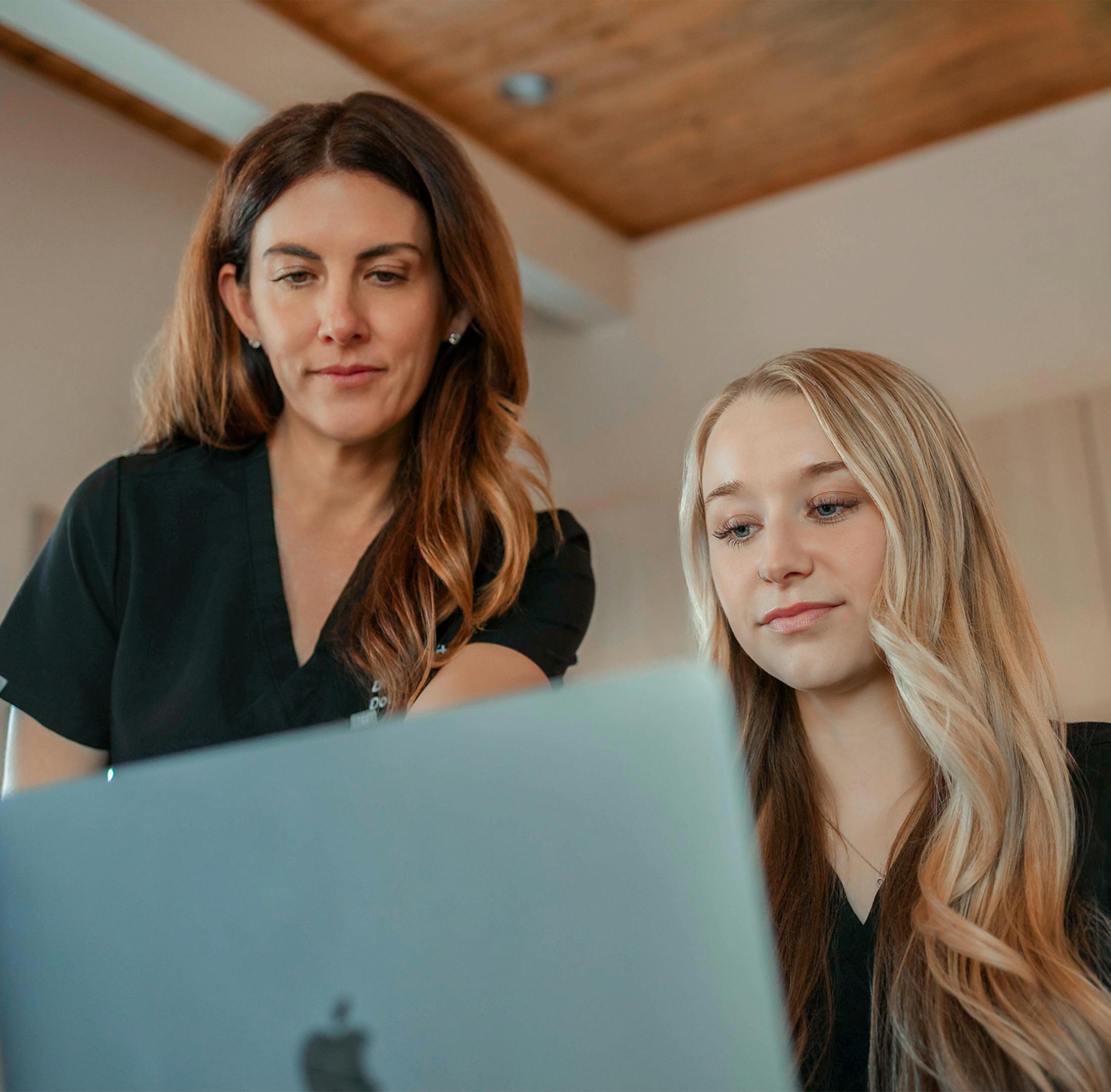 Two woman looking at a computer