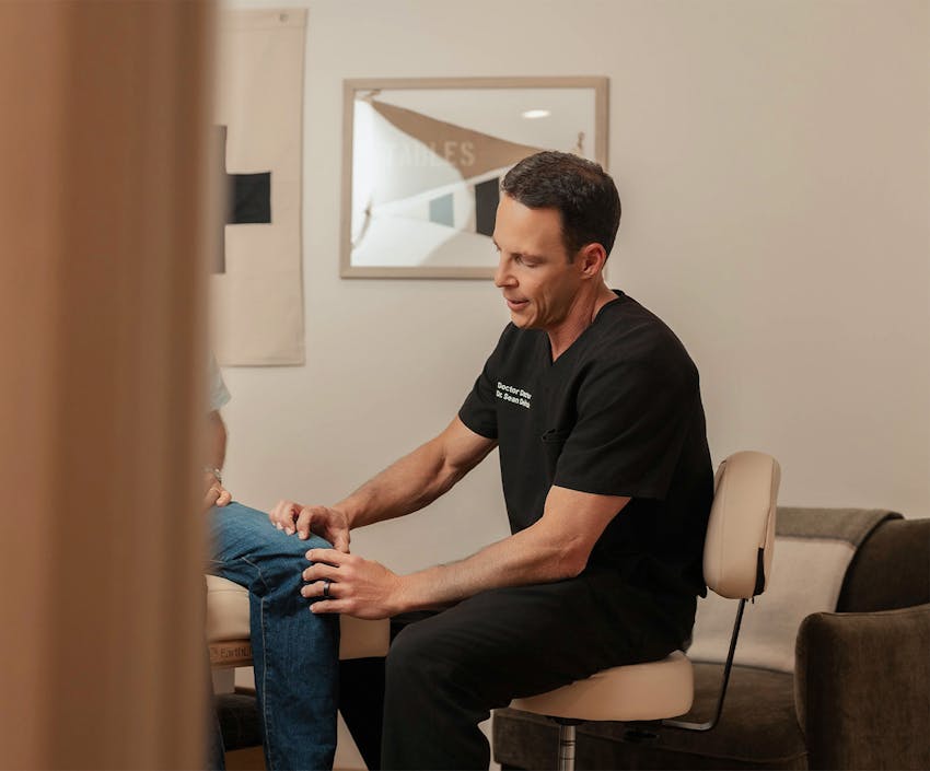 Doctor looking a patients knee