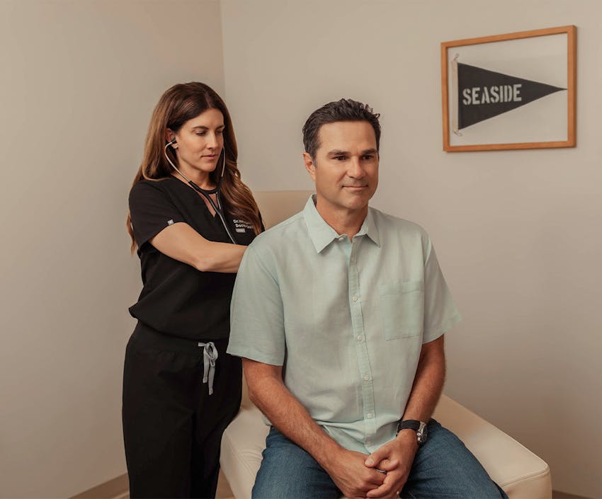 Doctor helping a patient