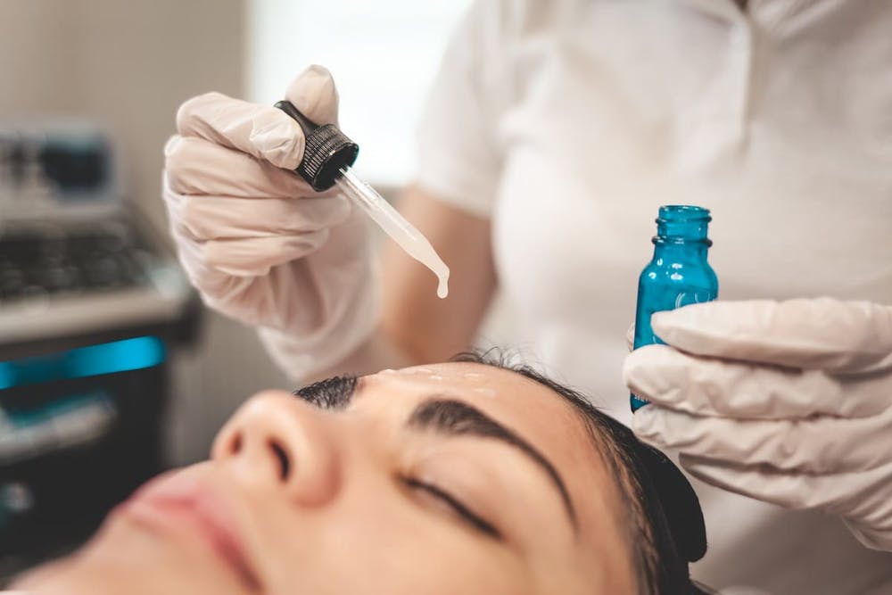 woman getting forehaed treatment
