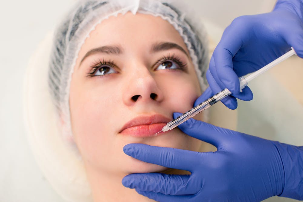 woman getting lip injection