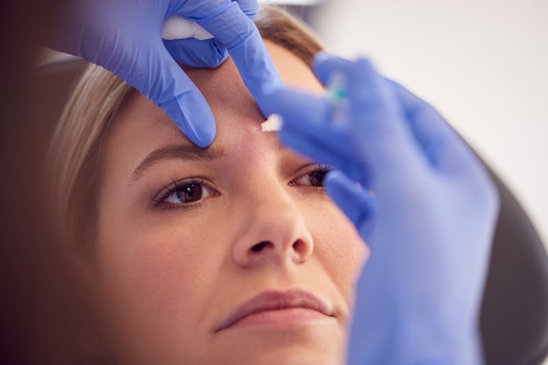 womna getting botox injection