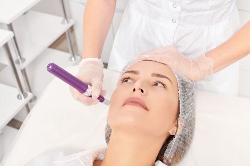 woman getting face treatment