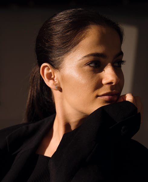 woman touching her chin