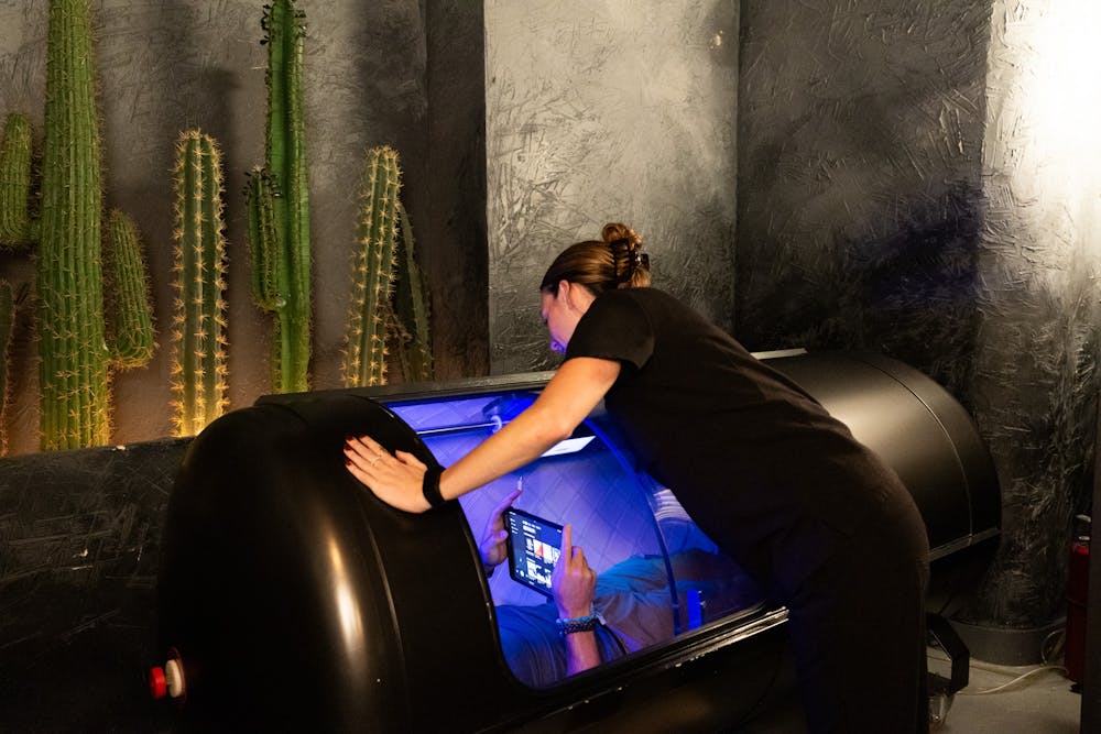 A patient lies down in a hyperbaric oxygen chamber as a form of athletic performance recovery in Chicago.