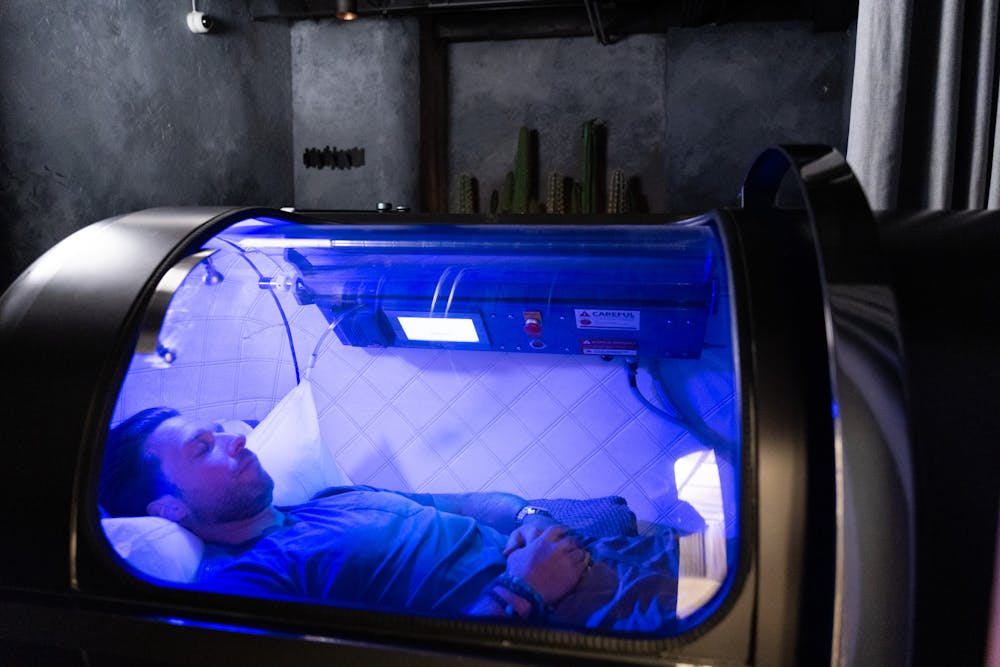 A man lies down in in a hyperbaric chamber near Lincoln Park Chicago.