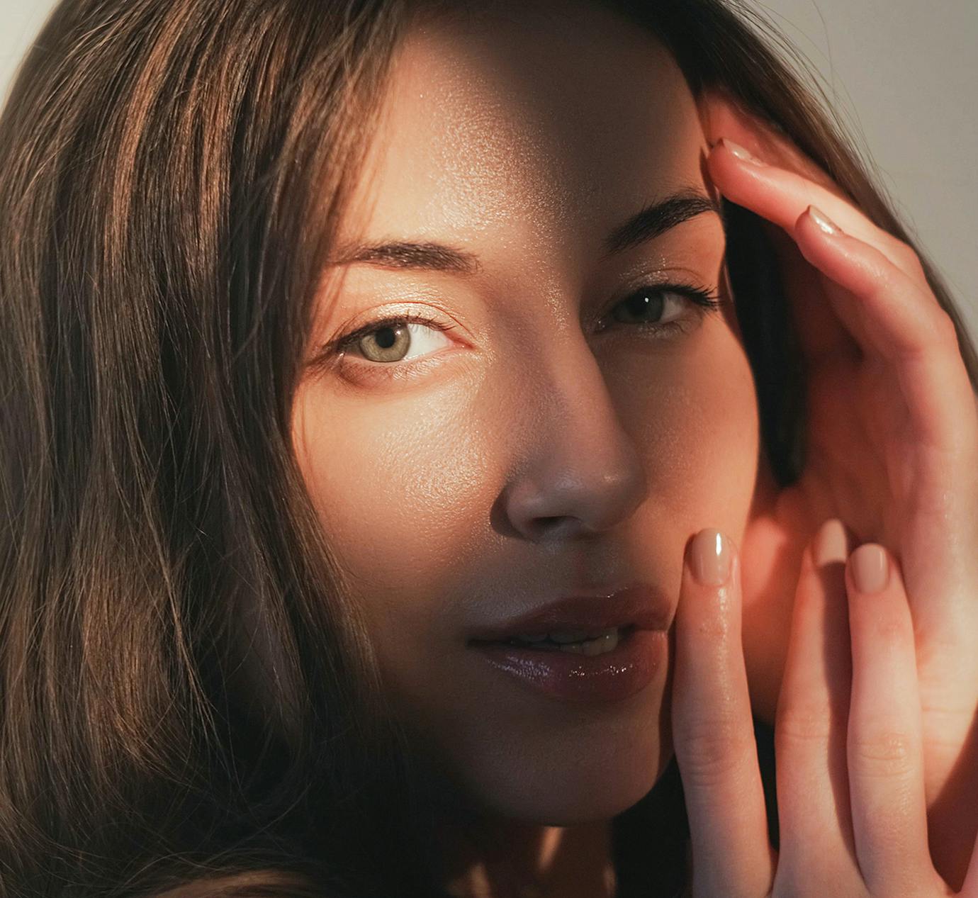 close up of womans face with shadows casted