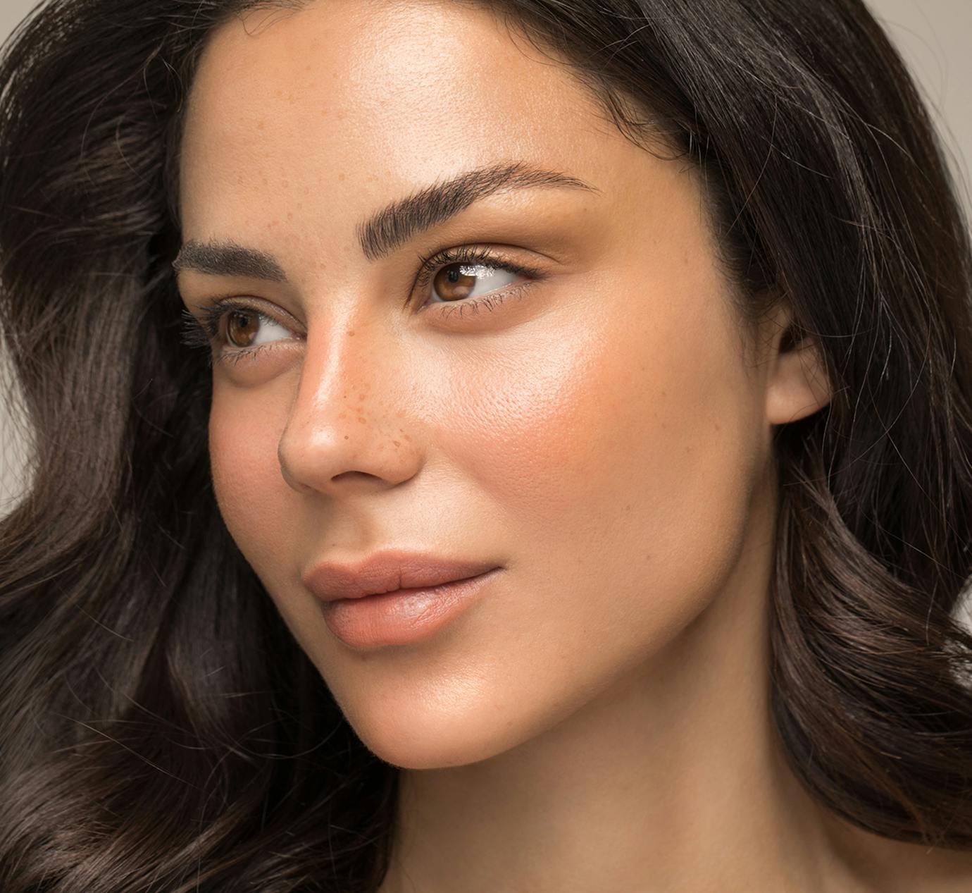 close up of womans face turned to the side
