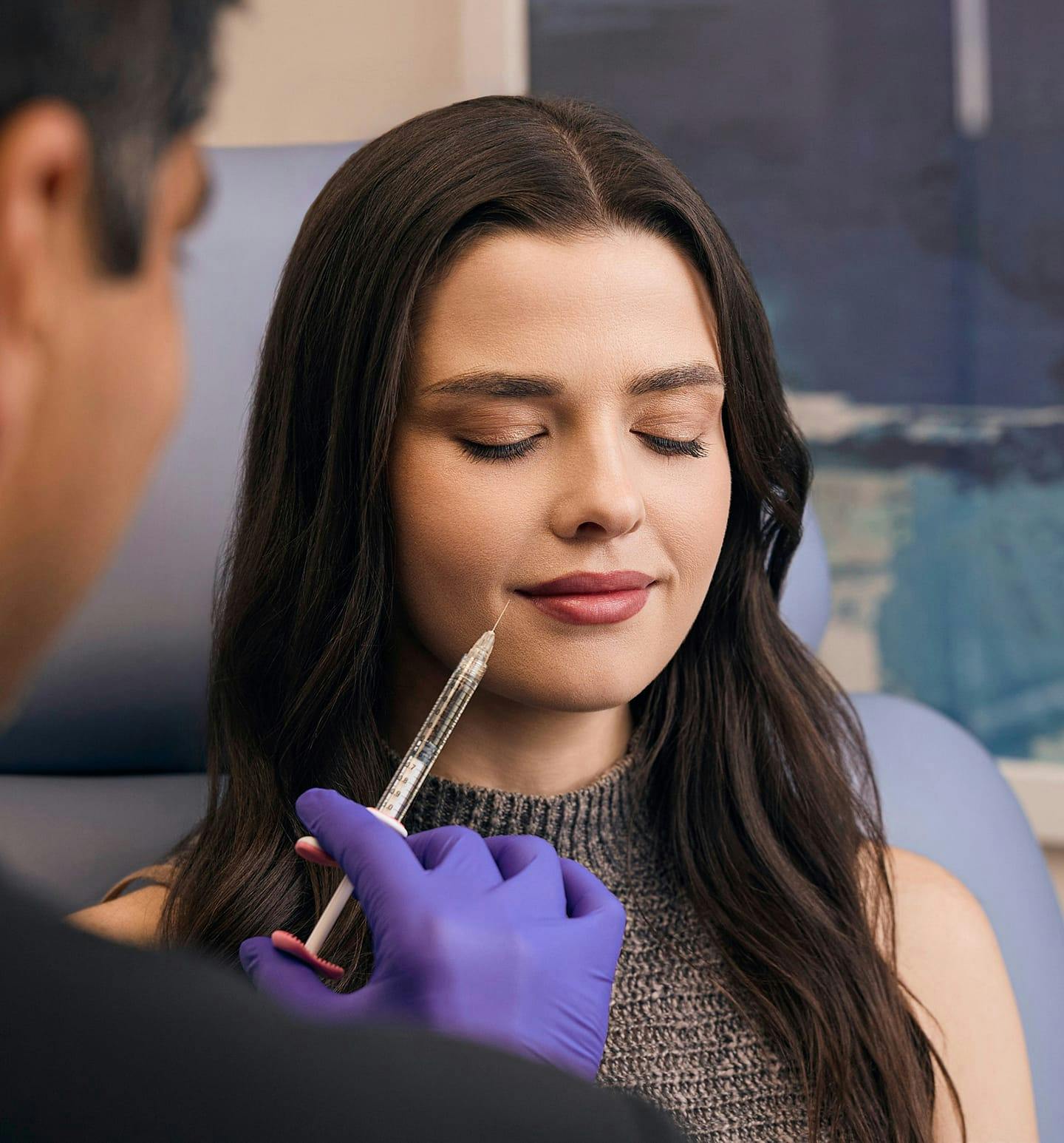 female patient getting an injectable treatment