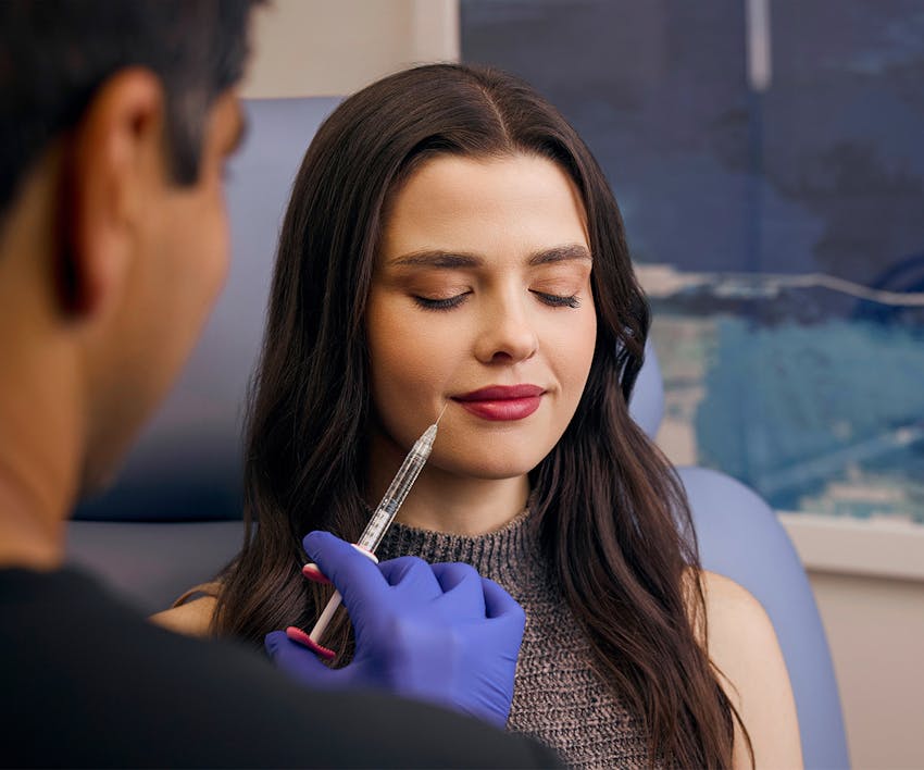 Dr. Mohan injecting