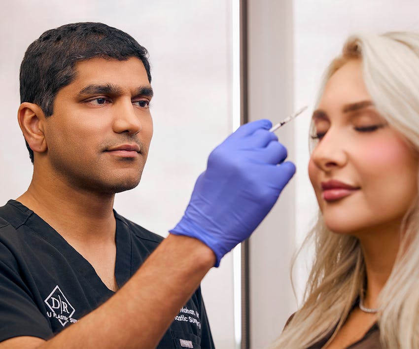 Dr. Mohan injecting