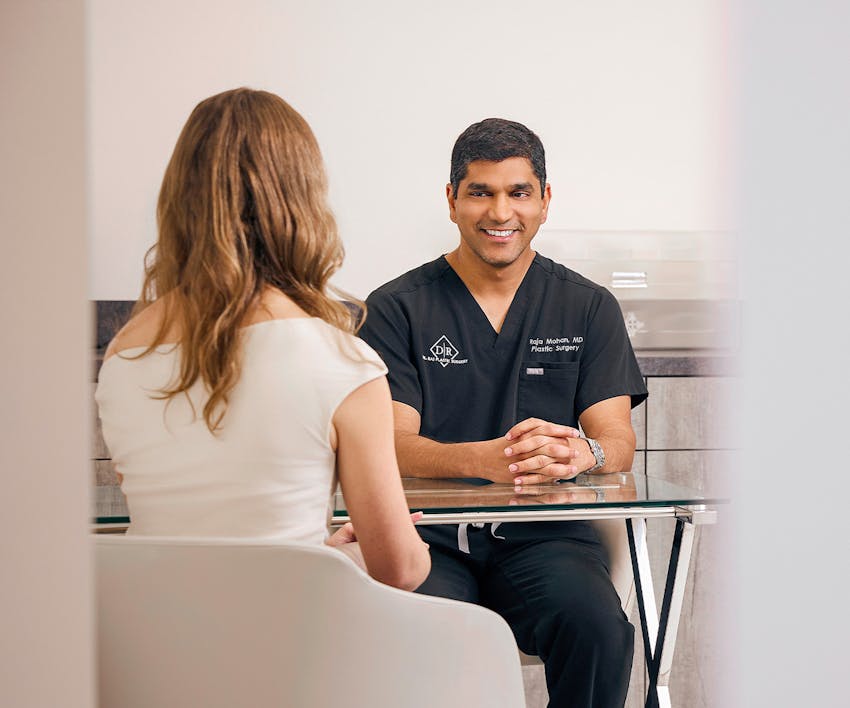 Dr. Mohan talking to client