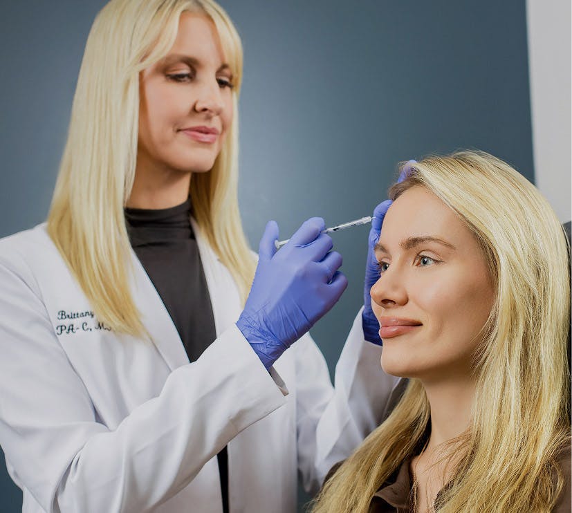 woman getting facial injection