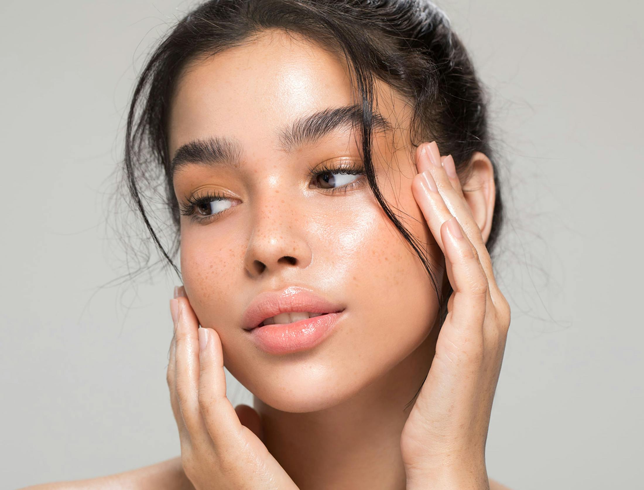 woman touching her face