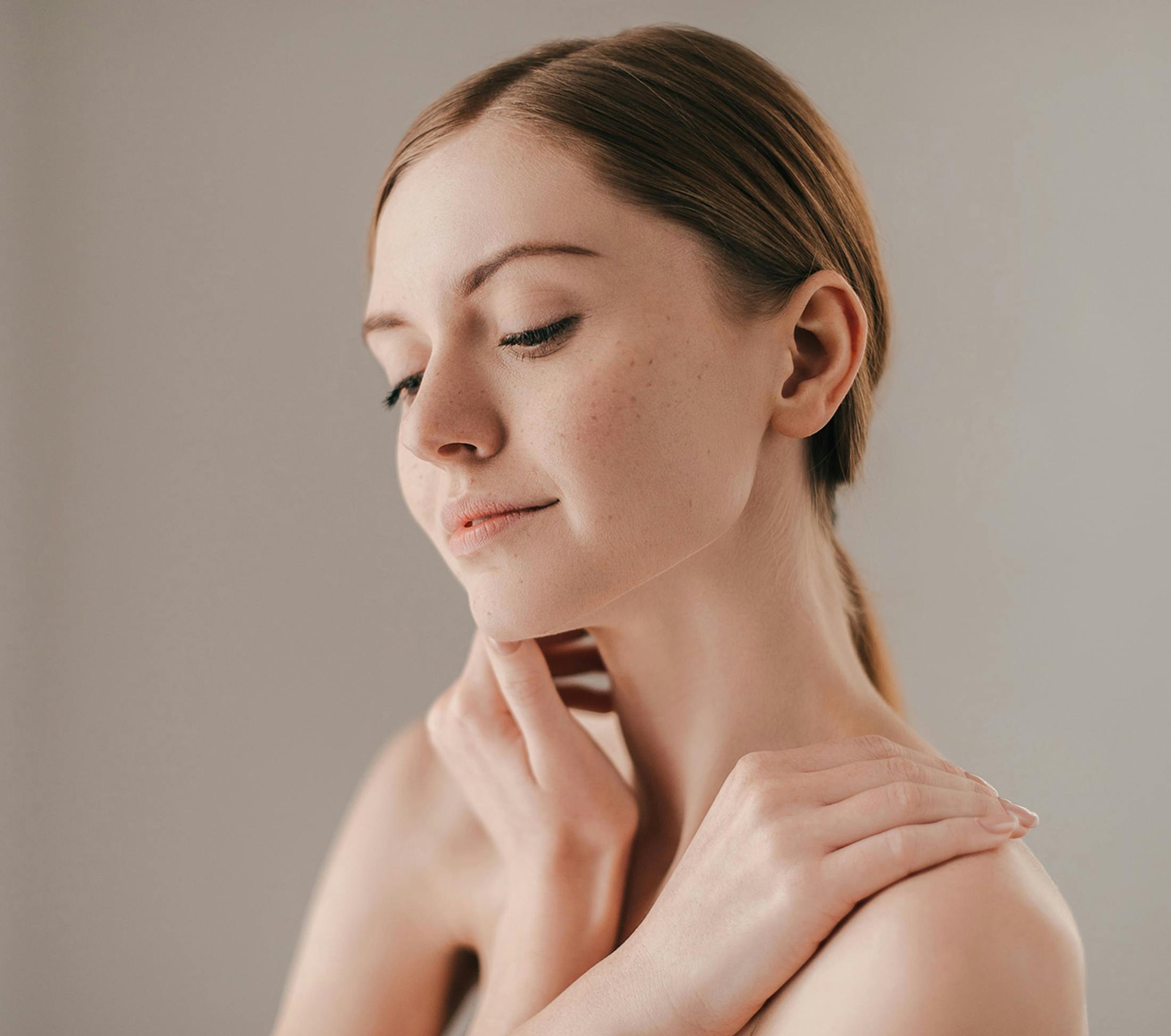woman looking down with arms crossed