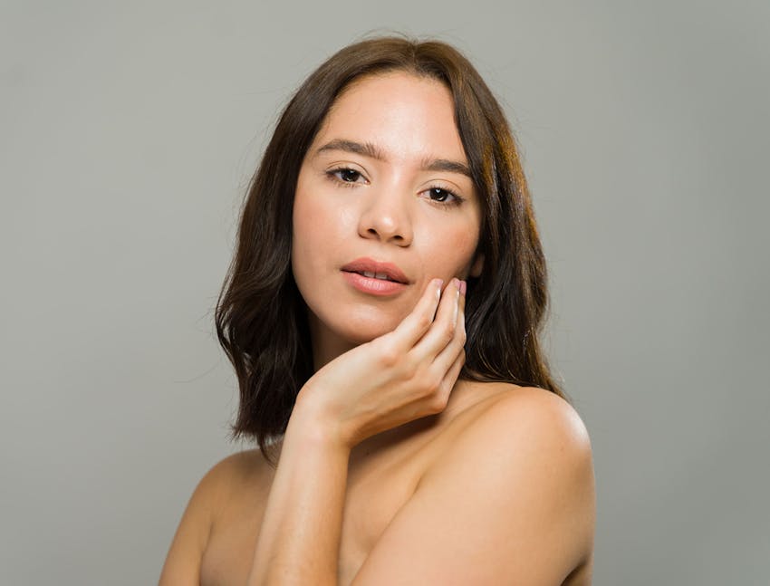 woman resting chin on hand