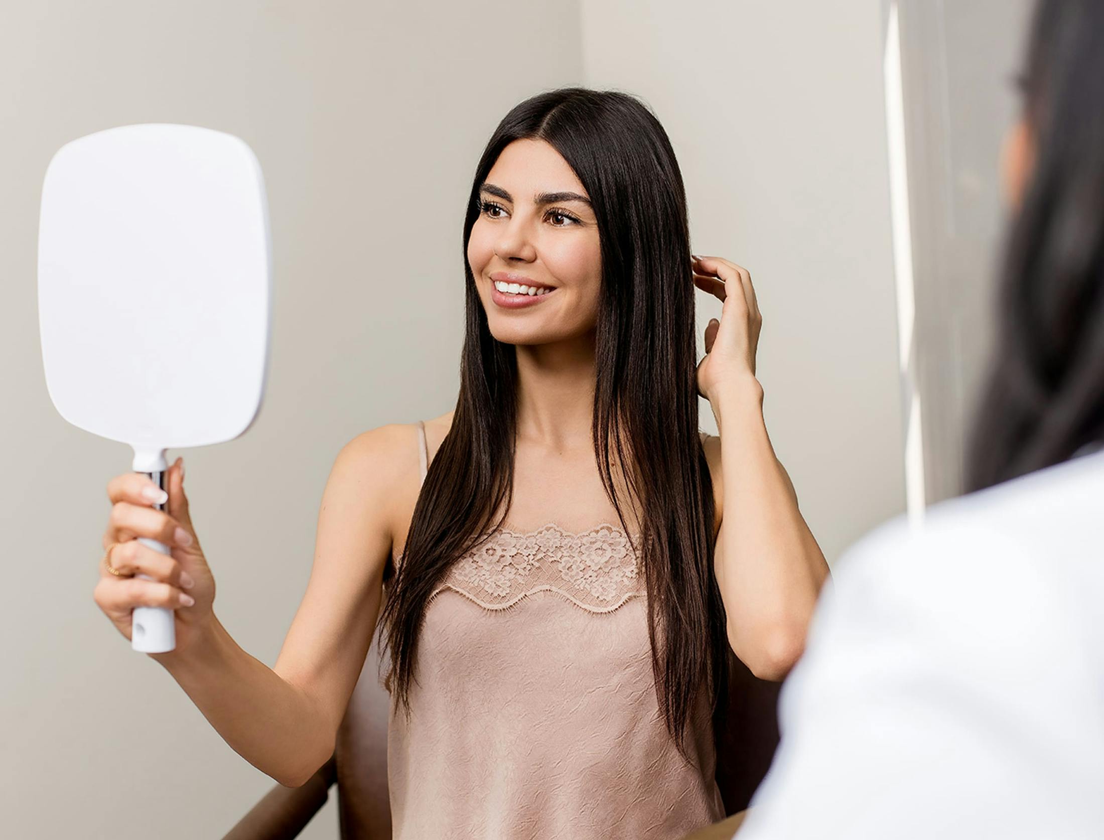 woman looking in the mirror