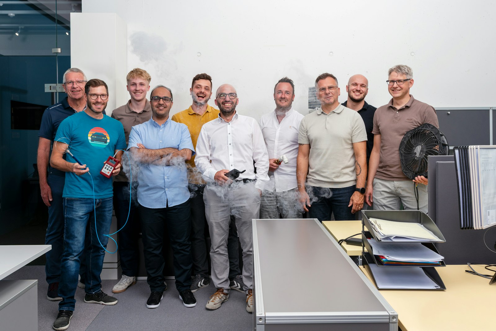 Erich Keller climate technology team demonstrating airflow with smoke in the office