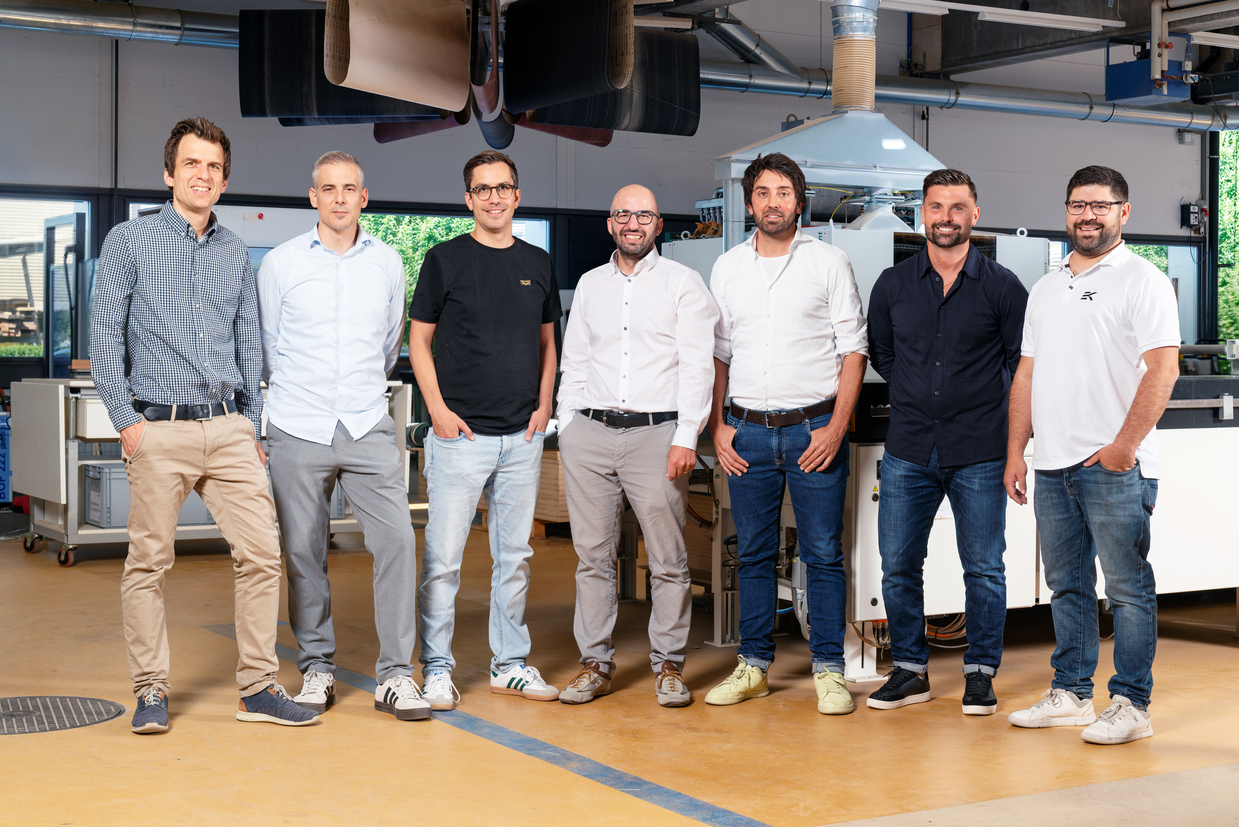 Geschäftsleitung der Erich Keller AG, Gruppenfoto in der Produktionshalle