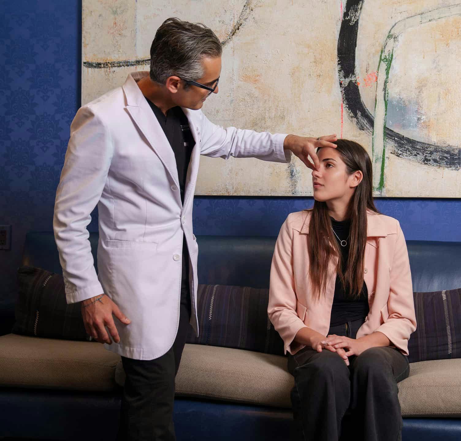 doctor holding nose