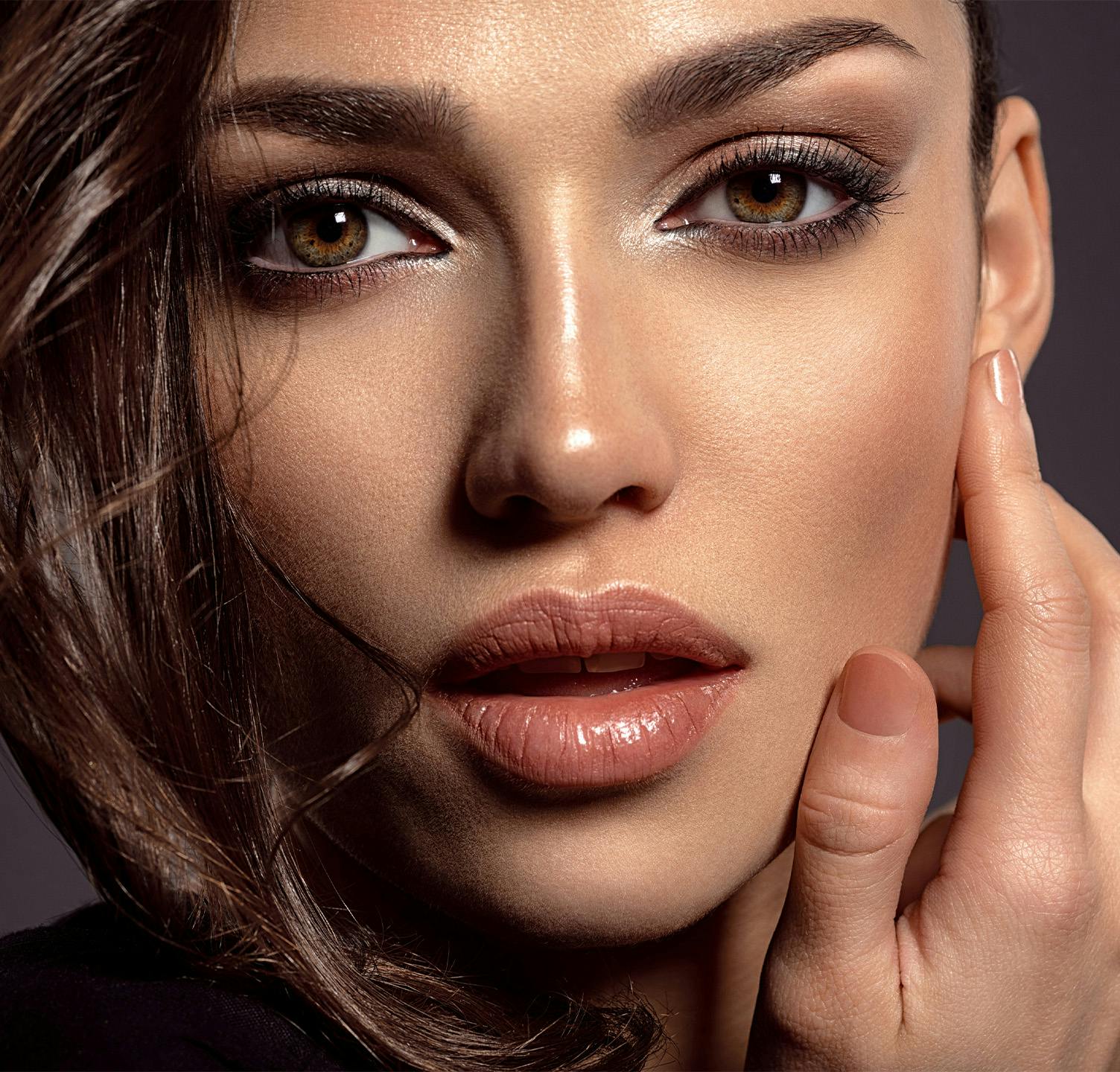 Woman touching her face