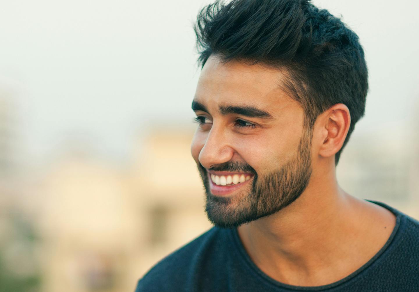man smiling looking to the side
