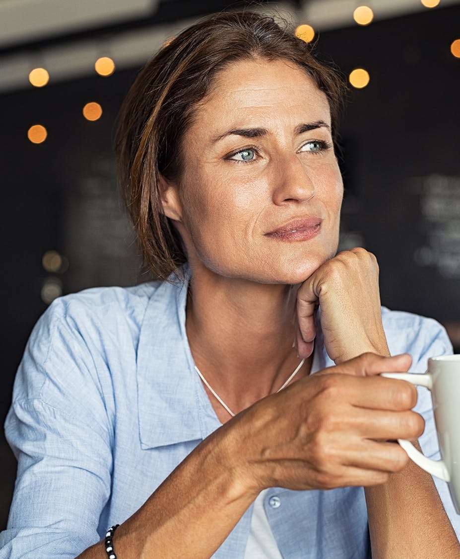 woman holding mug