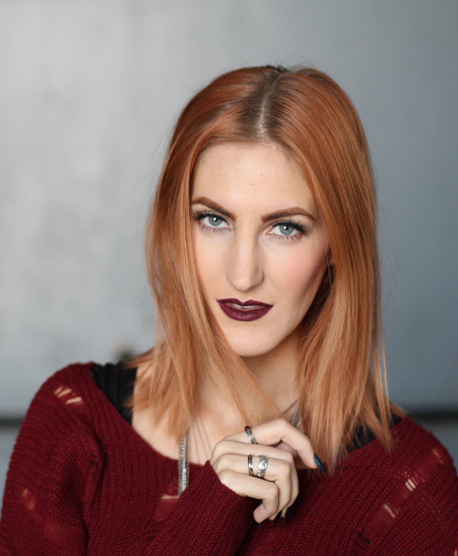 woman in red sweater looking at camera