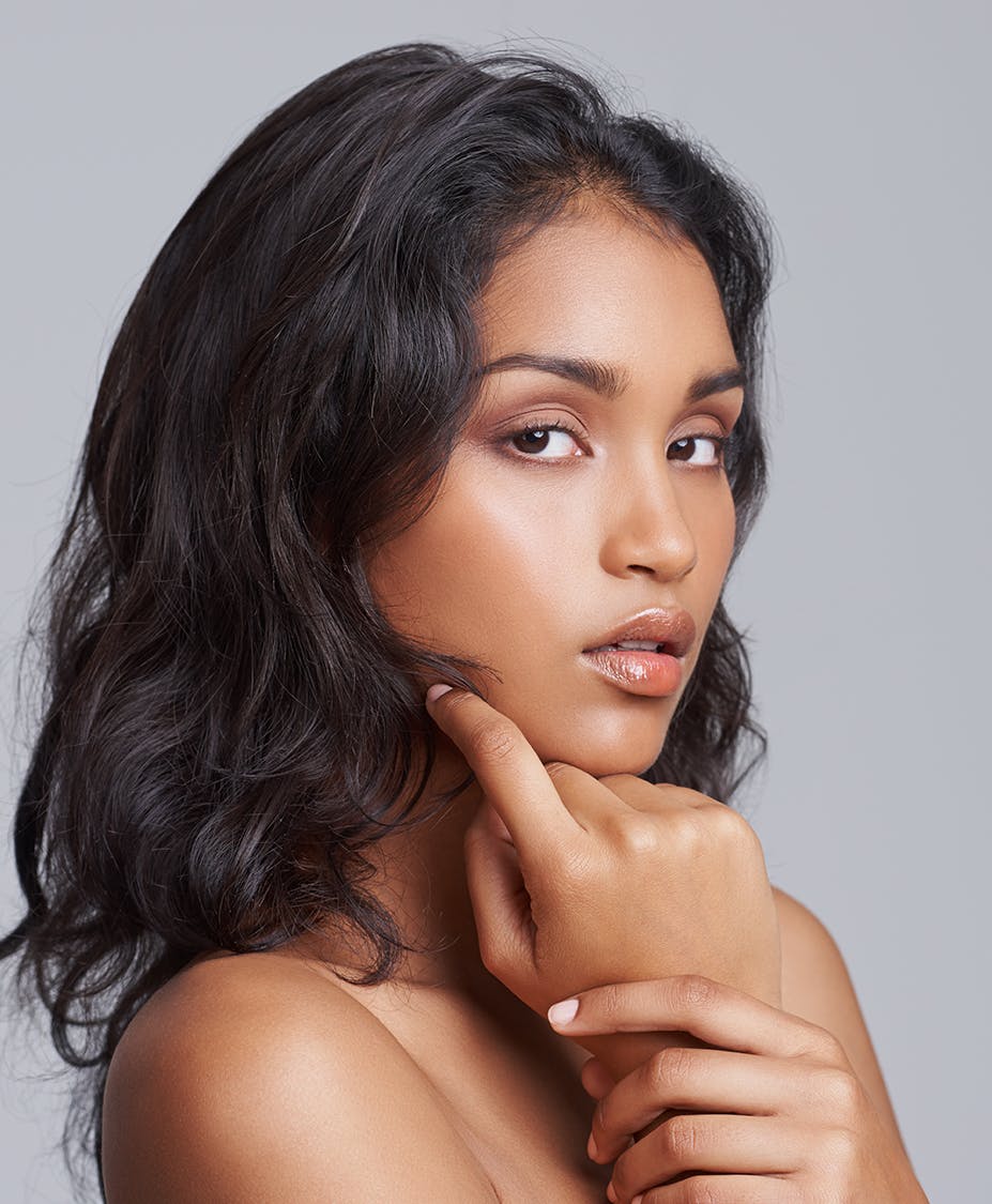 woman with hand on chin