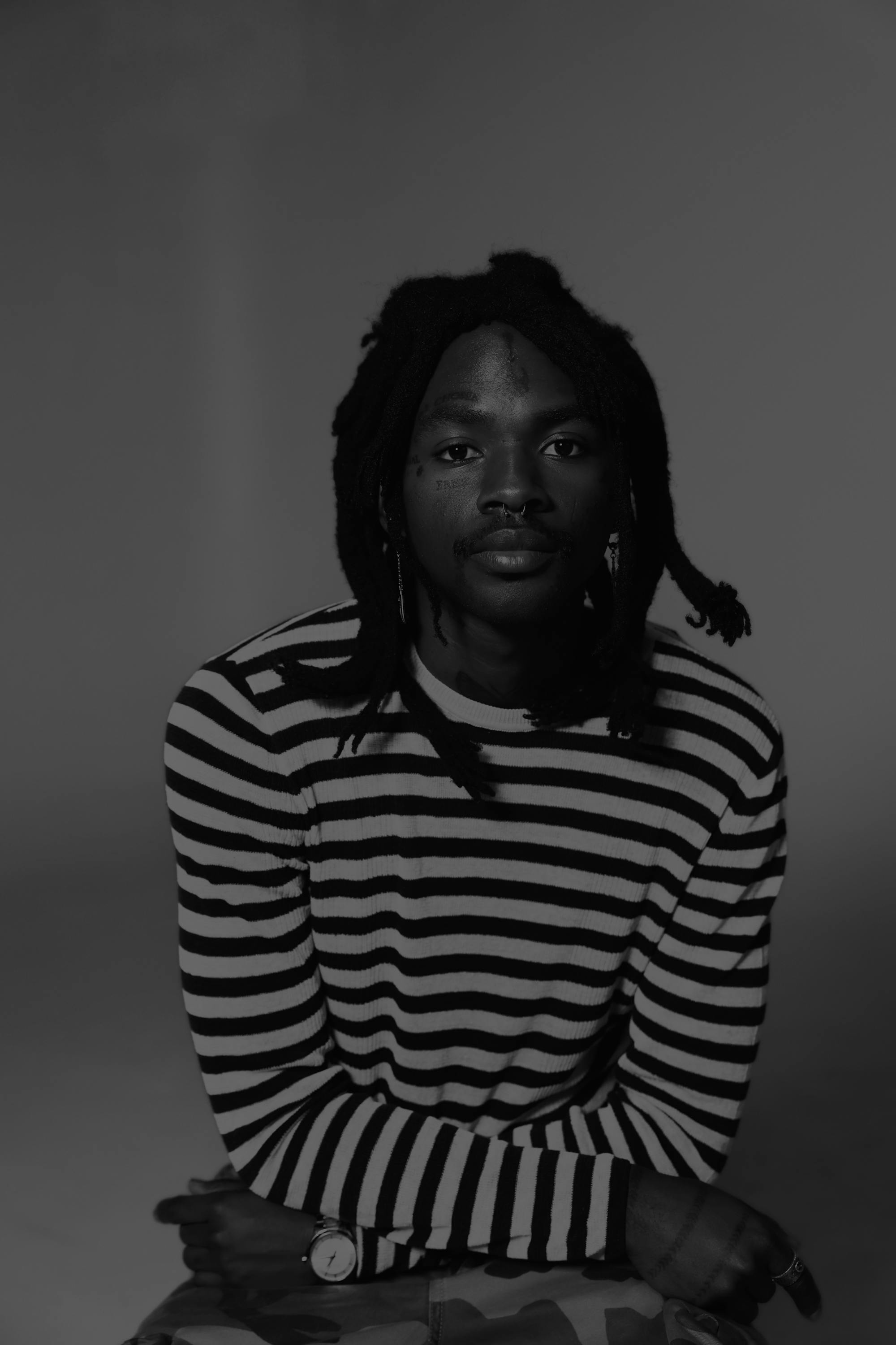 Black and white photo of Terry Presume in front of a white background