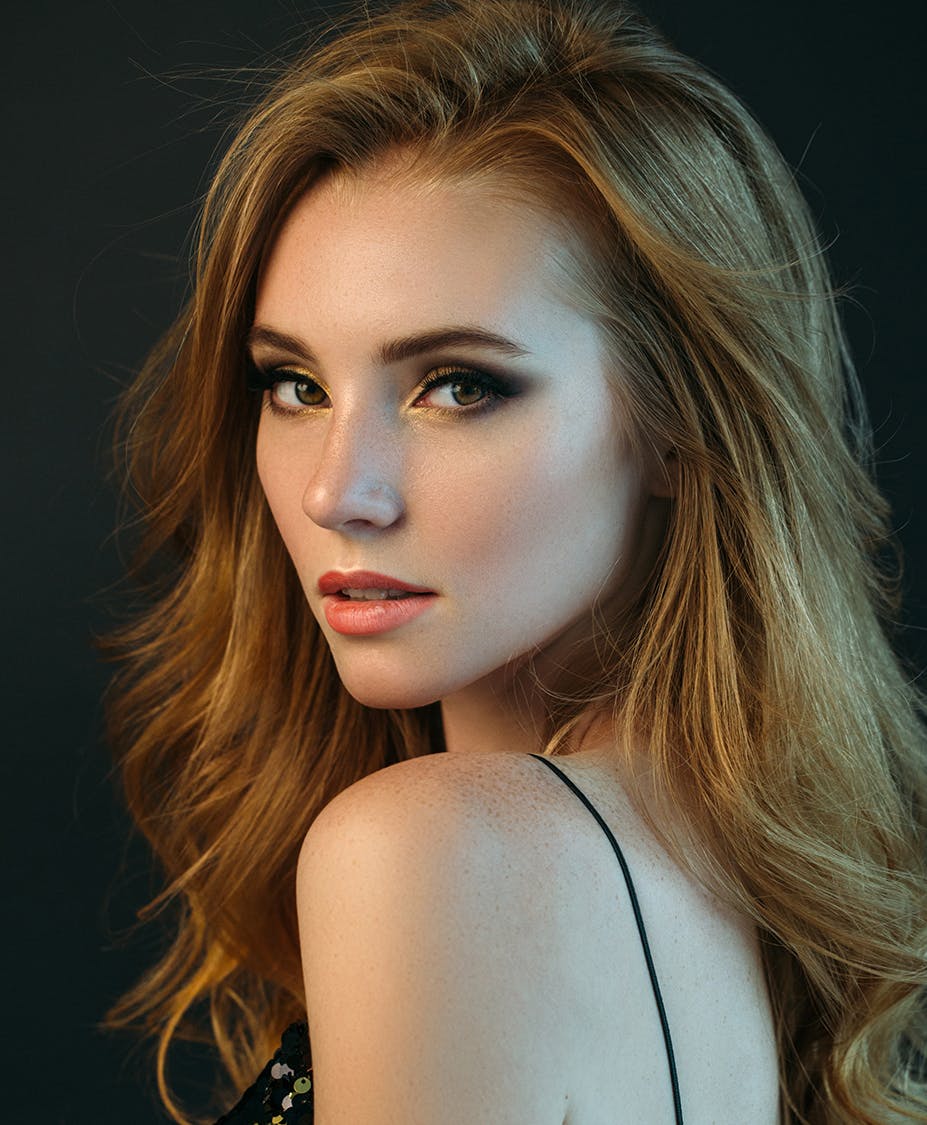 red headed woman looking over shoulder