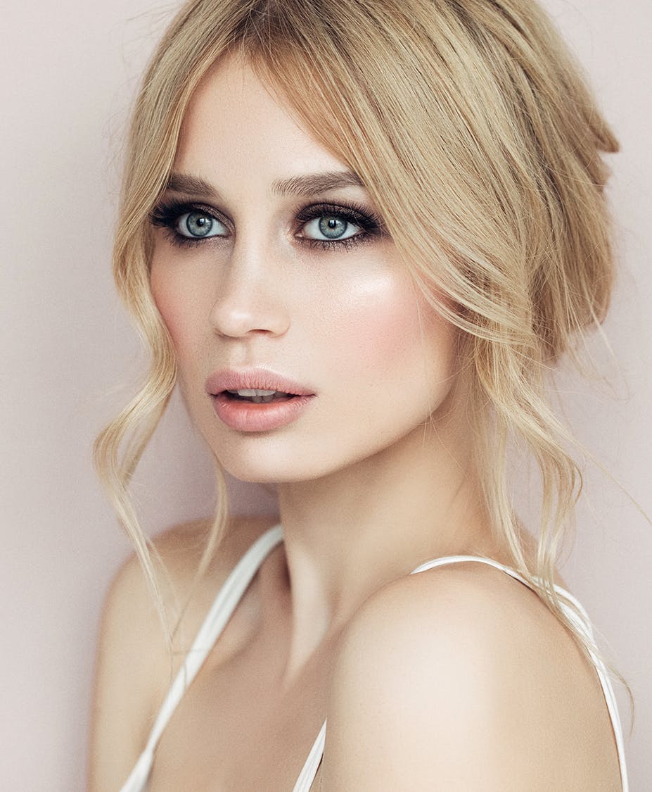 Blonde woman with heavy eye makeup