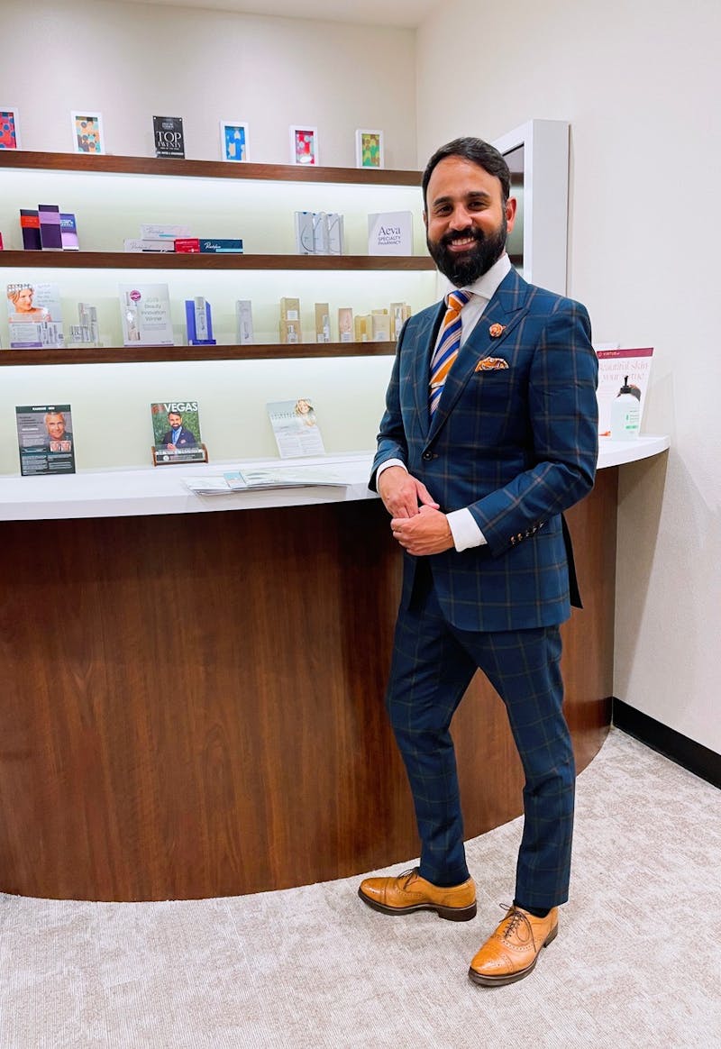Dr. Engineer standing at reception of the office