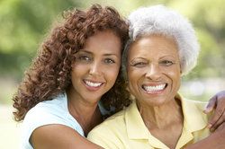 A younger and older woman with beautiful smiles