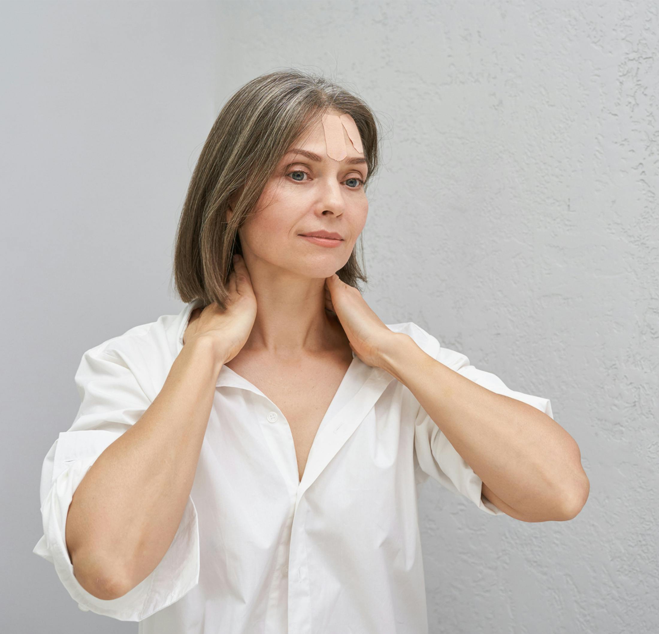 women holding her neck
